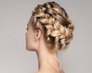 Blonde bride with her hair braided into a crown